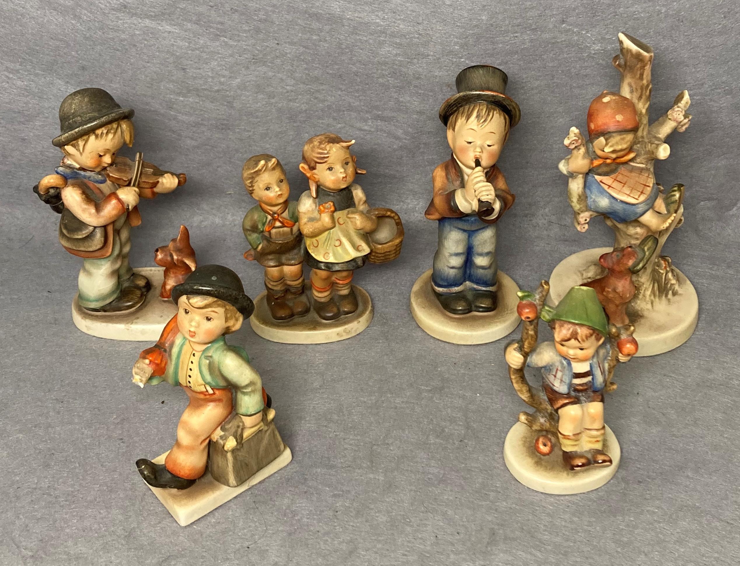 Six 20th Century Hummel ceramic figurines (one has been repaired) (saleroom location: S3 QC17 GC)