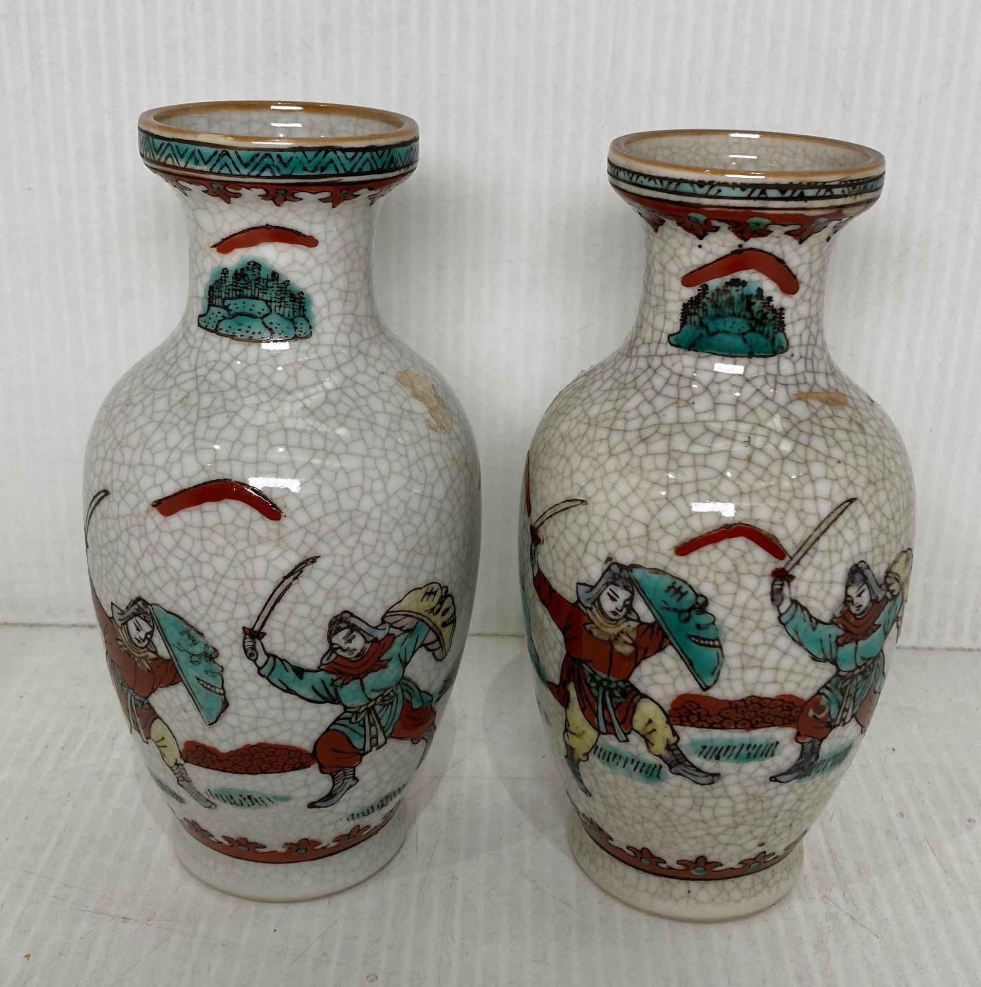 A pair of Chinese hand painted and crackle vases, 14.