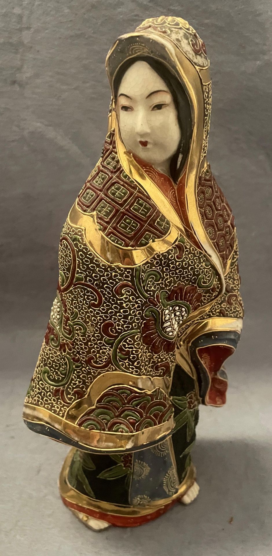 An Oriental Satsuma Kutani porcelain hand painted figurine,