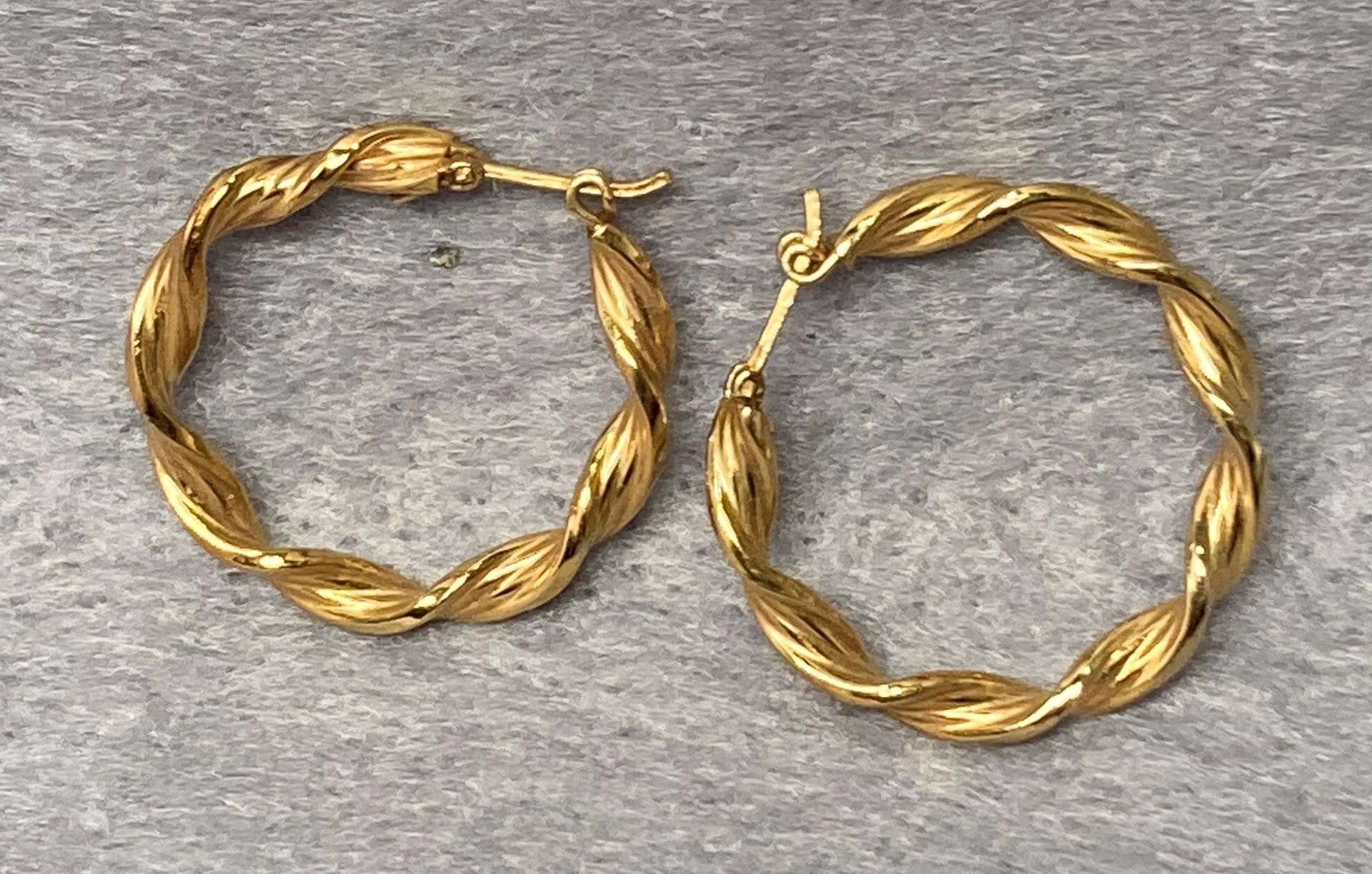 Two pairs of 9ct gold earrings - a twisted hoop pair and a flower stud pair together with a pair of - Image 4 of 4