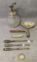 Eight silver hallmarked items including a 1925 silver top cut glass/crystal perfume bottle,