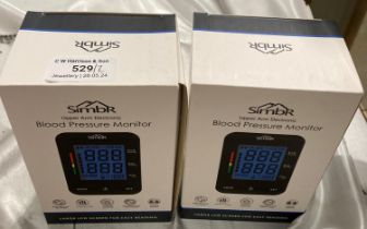 Two boxed Simbr upper arm electronic blood pressure monitors (saleroom location: S2 tables QB13)