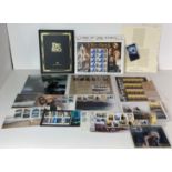 A collection of Lord of The Rings stamps including 'The Trilogy Collection' folder (full) and a