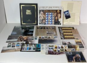A collection of Lord of The Rings stamps including 'The Trilogy Collection' folder (full) and a