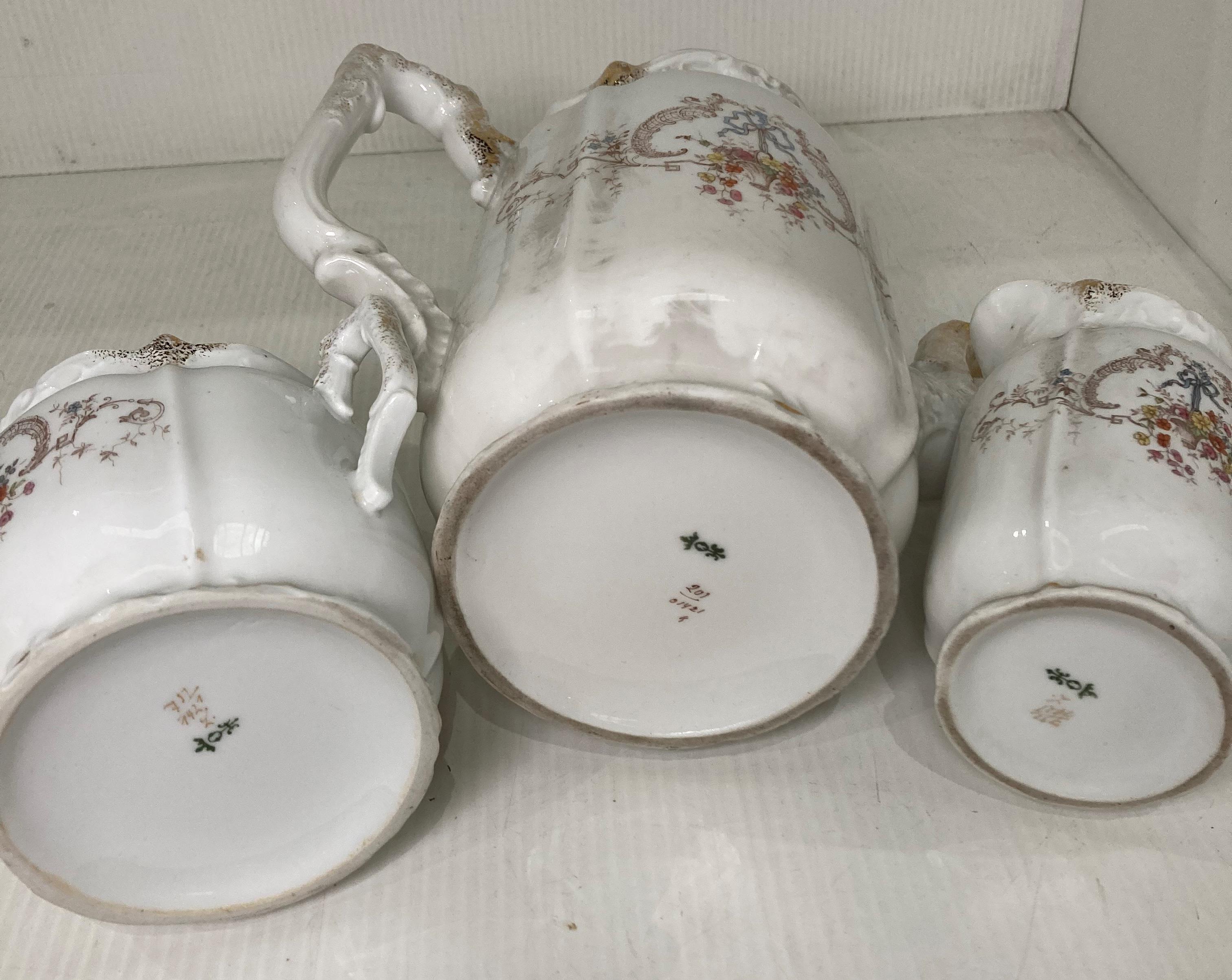 A late 19th Century Hermann Ohme three-piece tea service including sugar bowl (with lid), milk jug, - Image 5 of 5