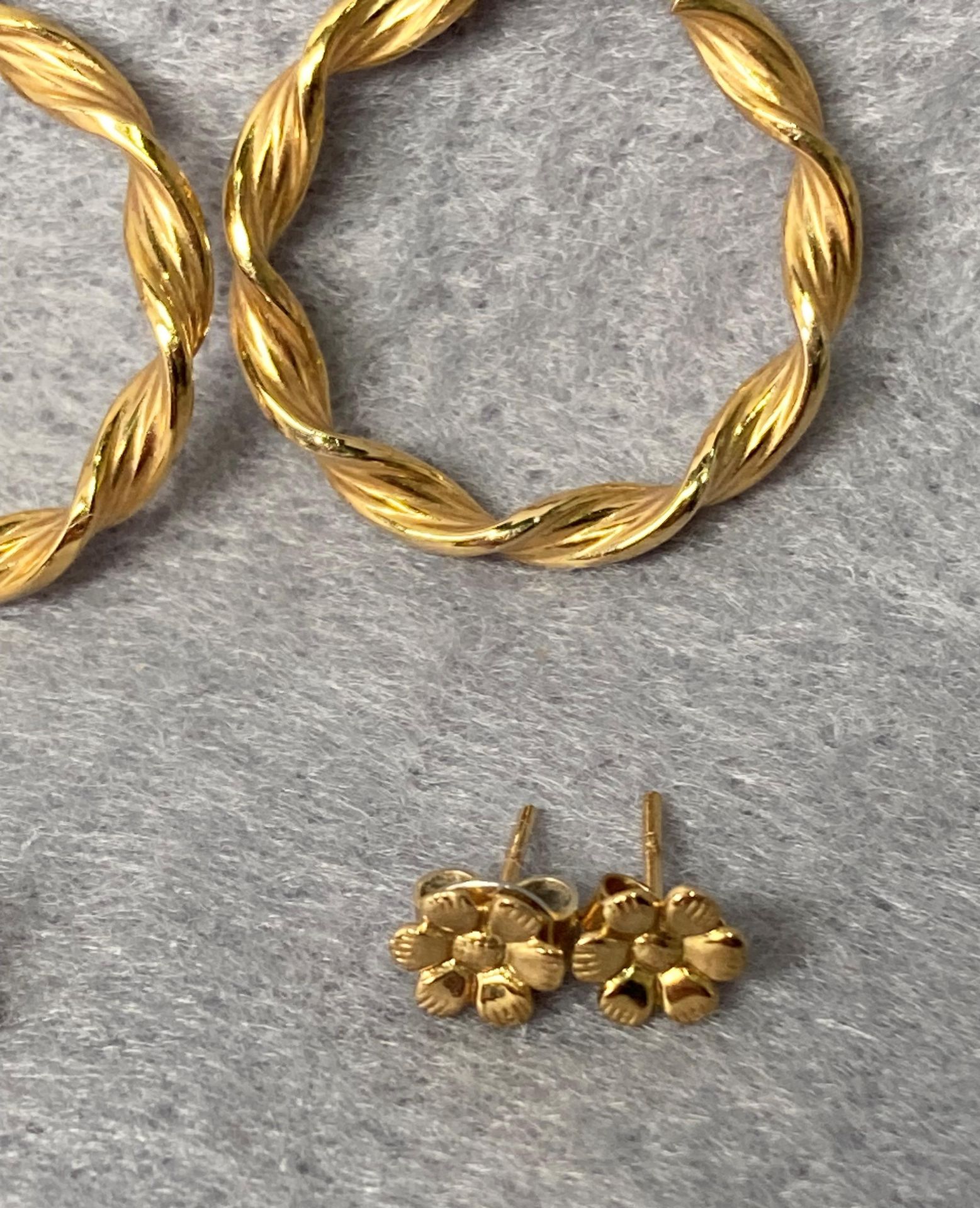 Two pairs of 9ct gold earrings - a twisted hoop pair and a flower stud pair together with a pair of - Image 3 of 4