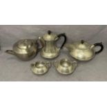 Four-piece pewter tea service by Craftsman in a hammered finish and stainless tea pot (saleroom
