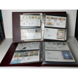 Two Royal Mint First Day Cover folders with approximately 105 First Day Covers stamps including