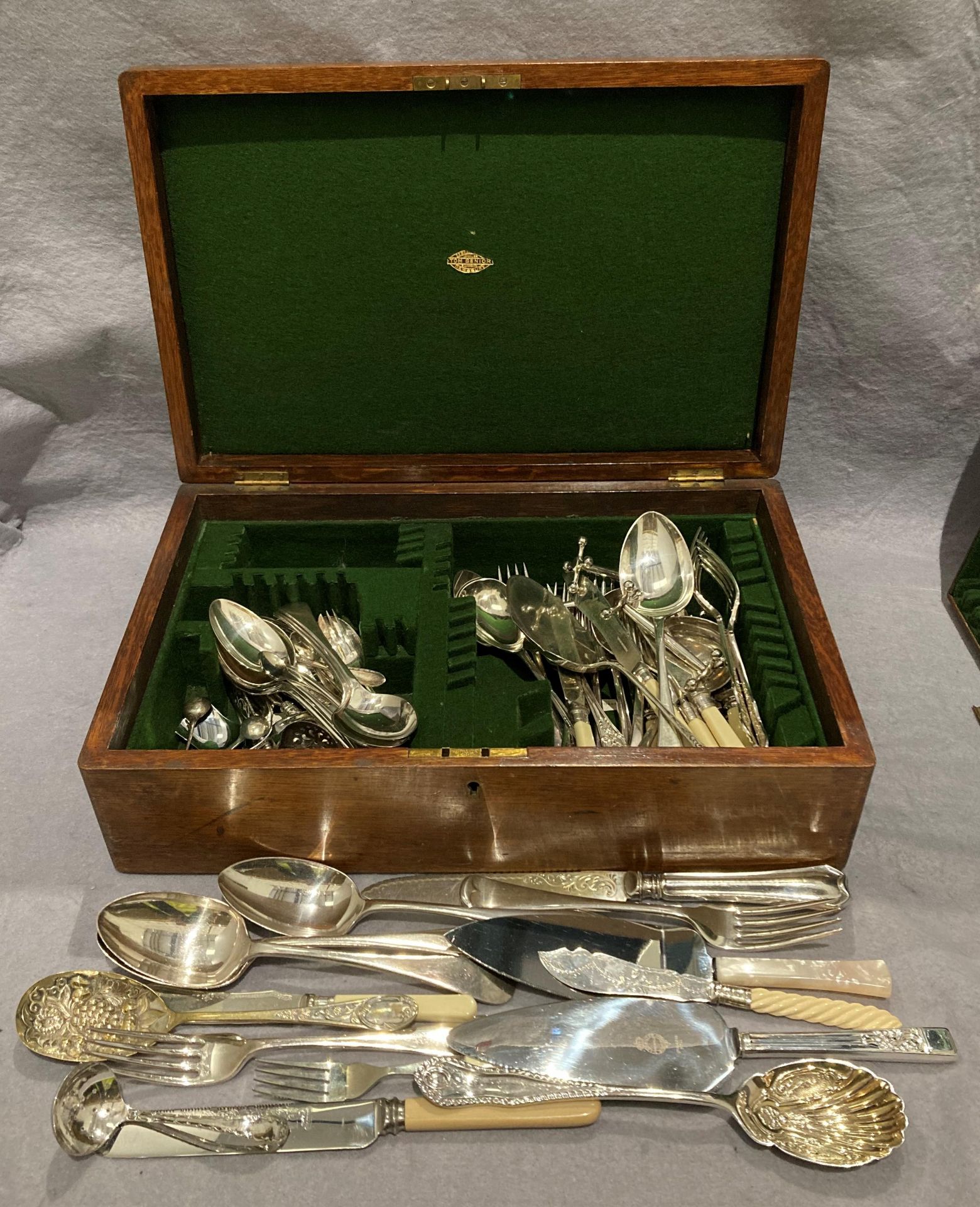 Mahogany canteen of cutlery cases with plain brass oval plaque and lift-out tray and approximately