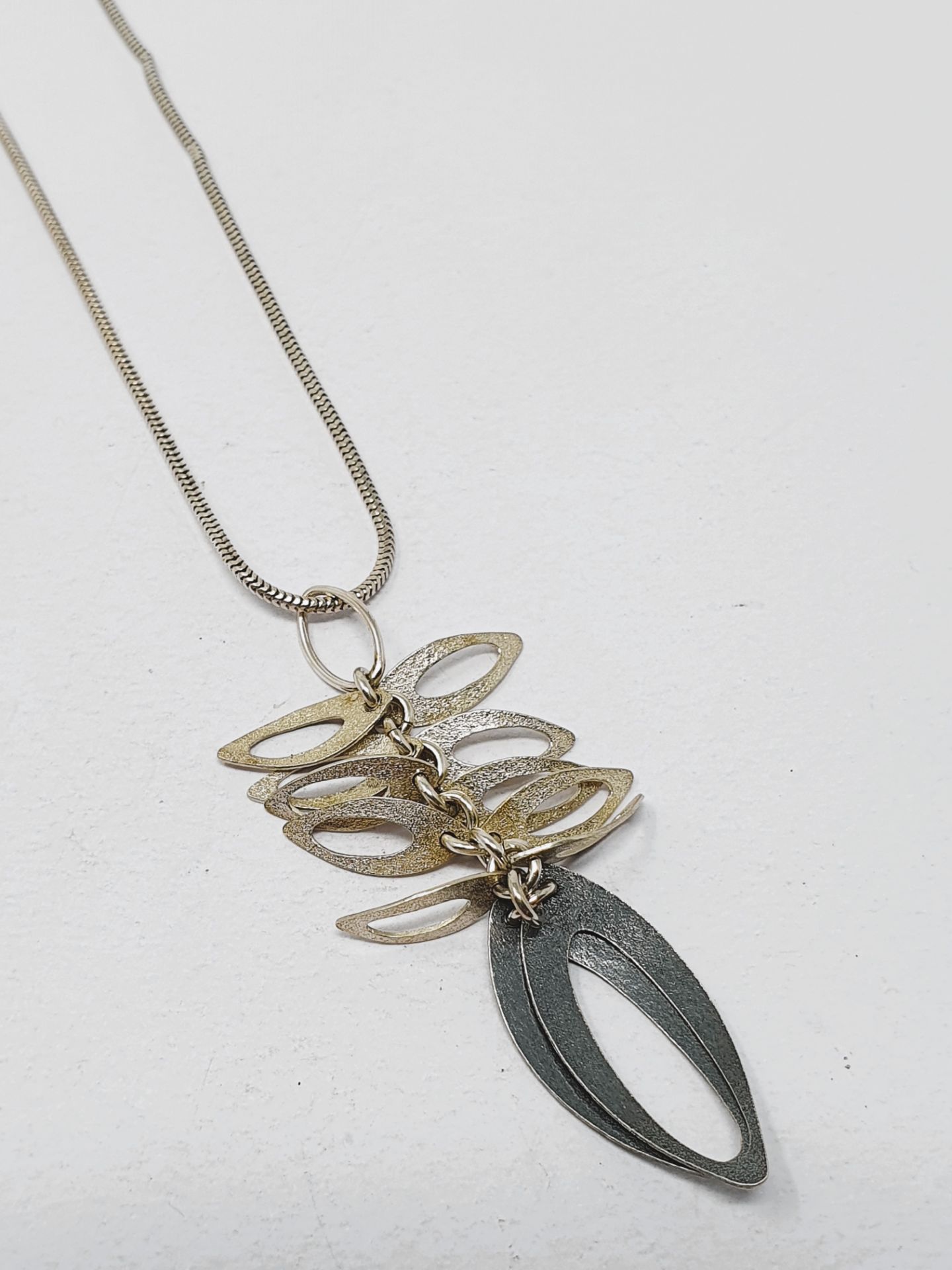 Sian Elizabeth Hughes, handmade sterling silver 'Foliage' necklace and two 'Bloom' pendants, - Image 4 of 5