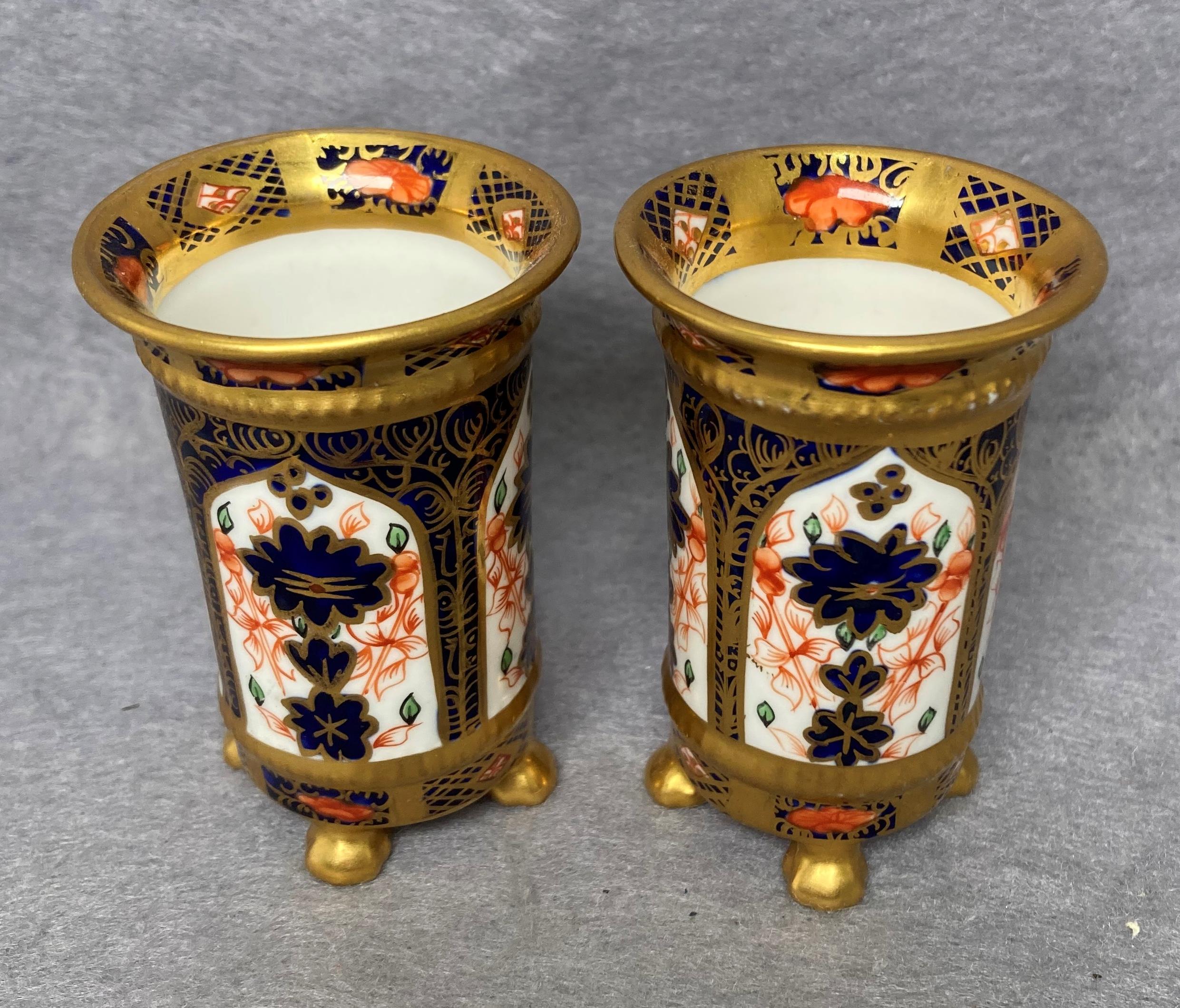 Two Royal Crown Derby spill vases in Imari pattern on paw feet,