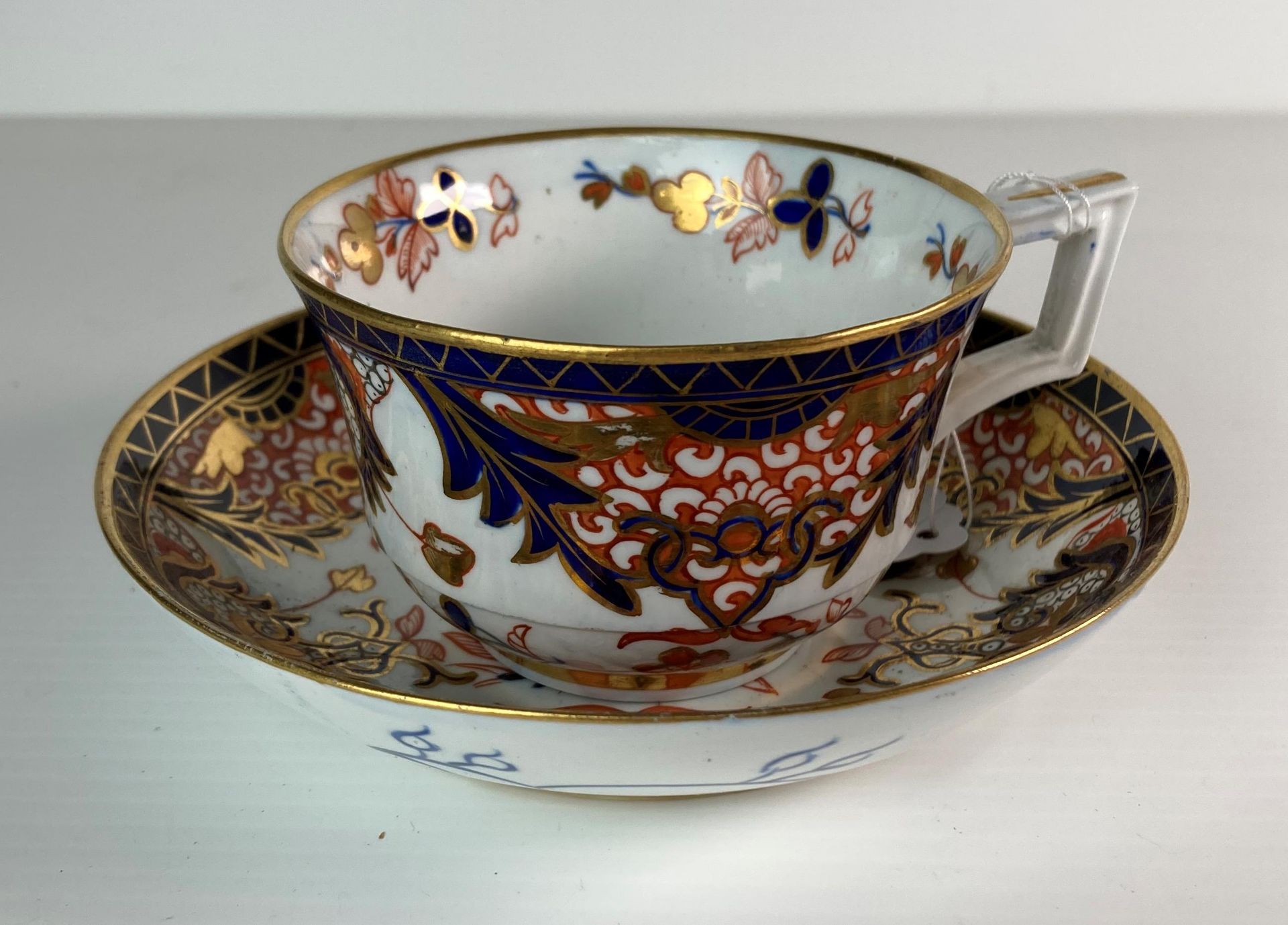 A vintage Royal Crown Derby teacup and side plate/shallow dish with Imari pattern (saleroom
