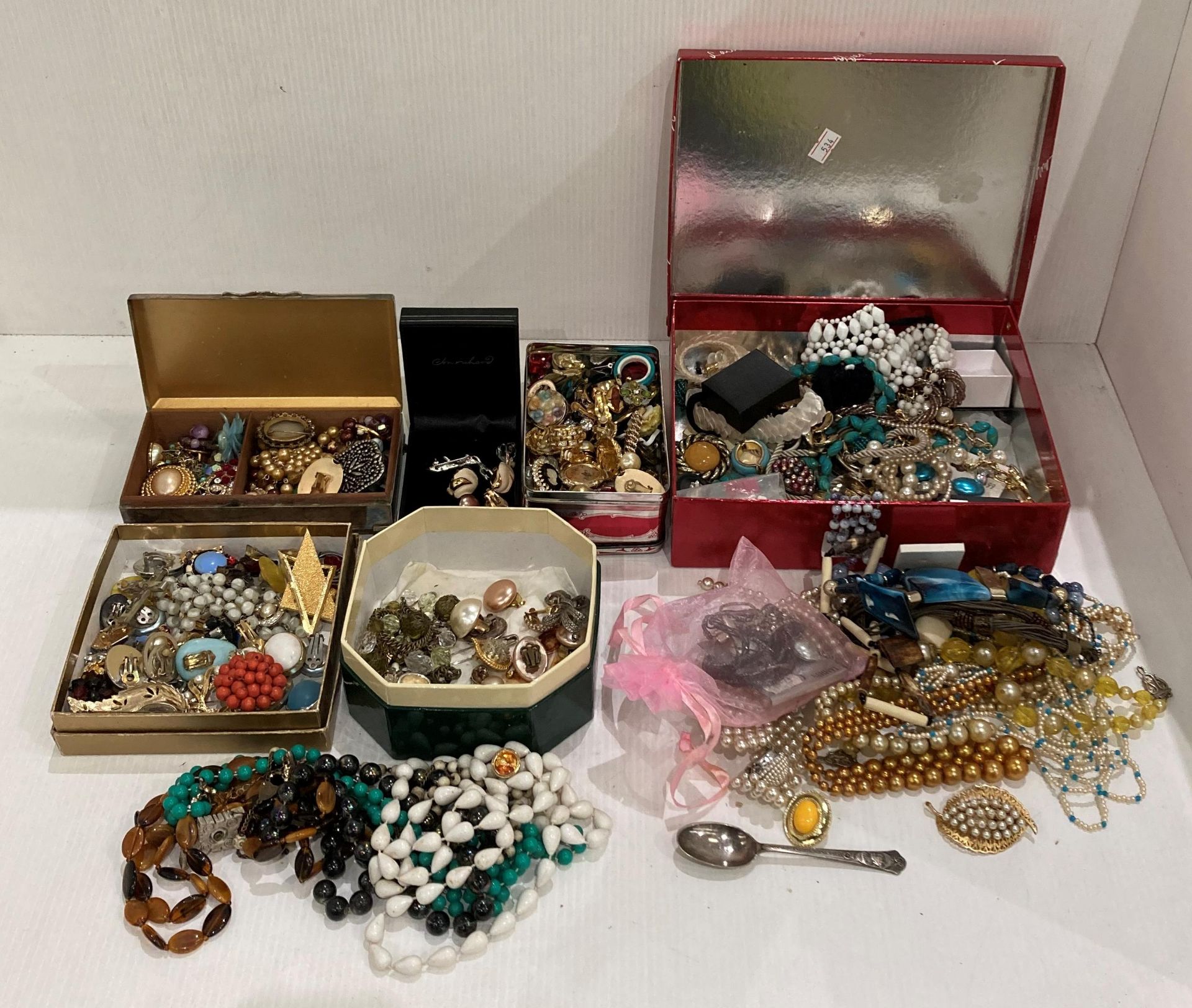 Large quantity of costume jewellery in tins and boxes including an Aristocrat EPNS cigarette box,