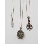 Sterling silver pendants with chains, including one diamond-set, one ruby-set,
