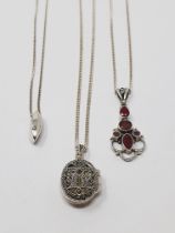 Sterling silver pendants with chains, including one diamond-set, one ruby-set,