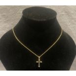 9ct gold (375) pendant cross with seven black stones and twelve clear stones (stones not tested)