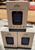 Three boxed Simbr upper arm electronic blood pressure monitors (saleroom location: S2 tables QB13)