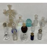 Thirteen assorted perfume bottles including vintage and modern pieces and a blown glass candelabra