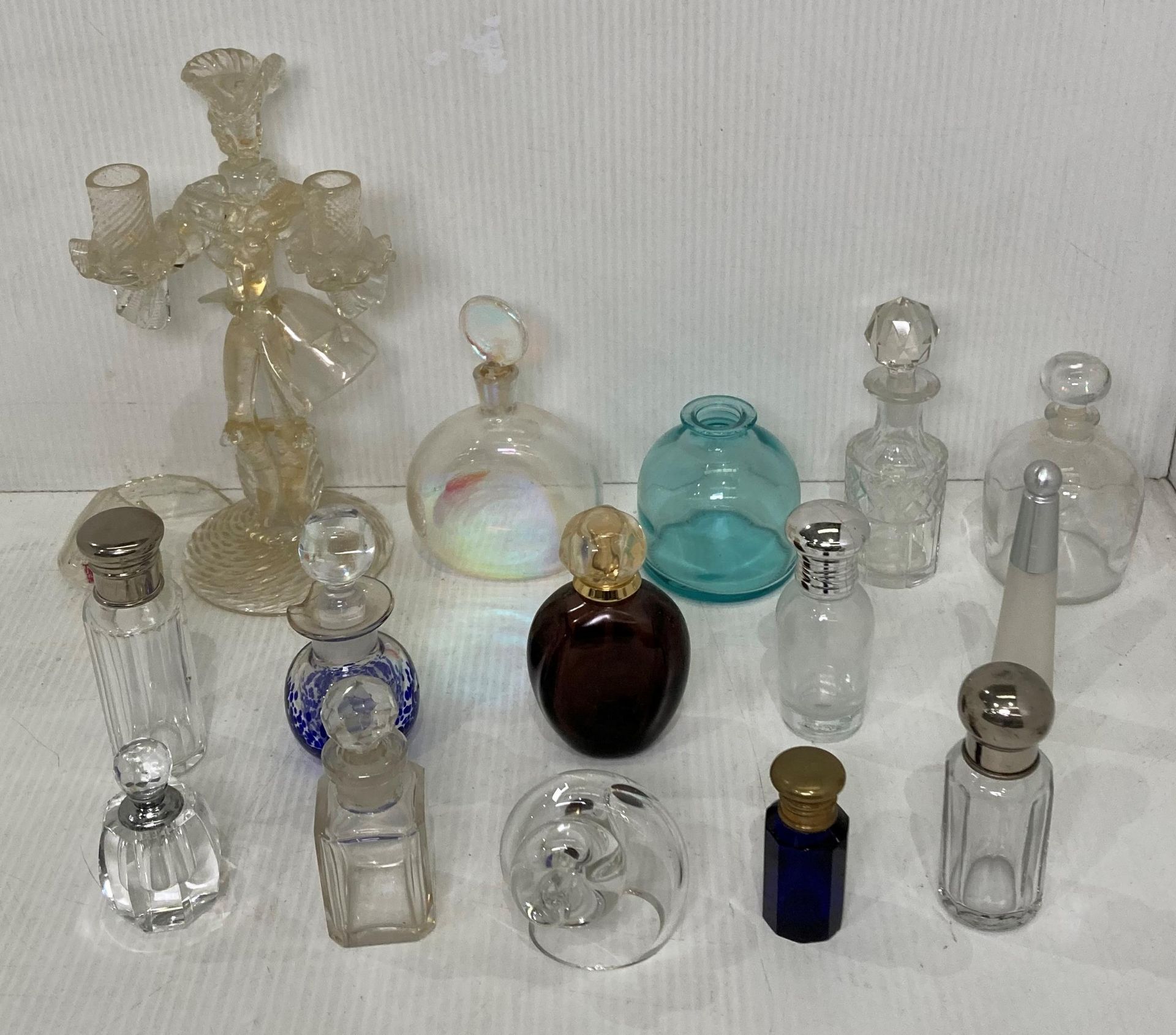 Thirteen assorted perfume bottles including vintage and modern pieces and a blown glass candelabra
