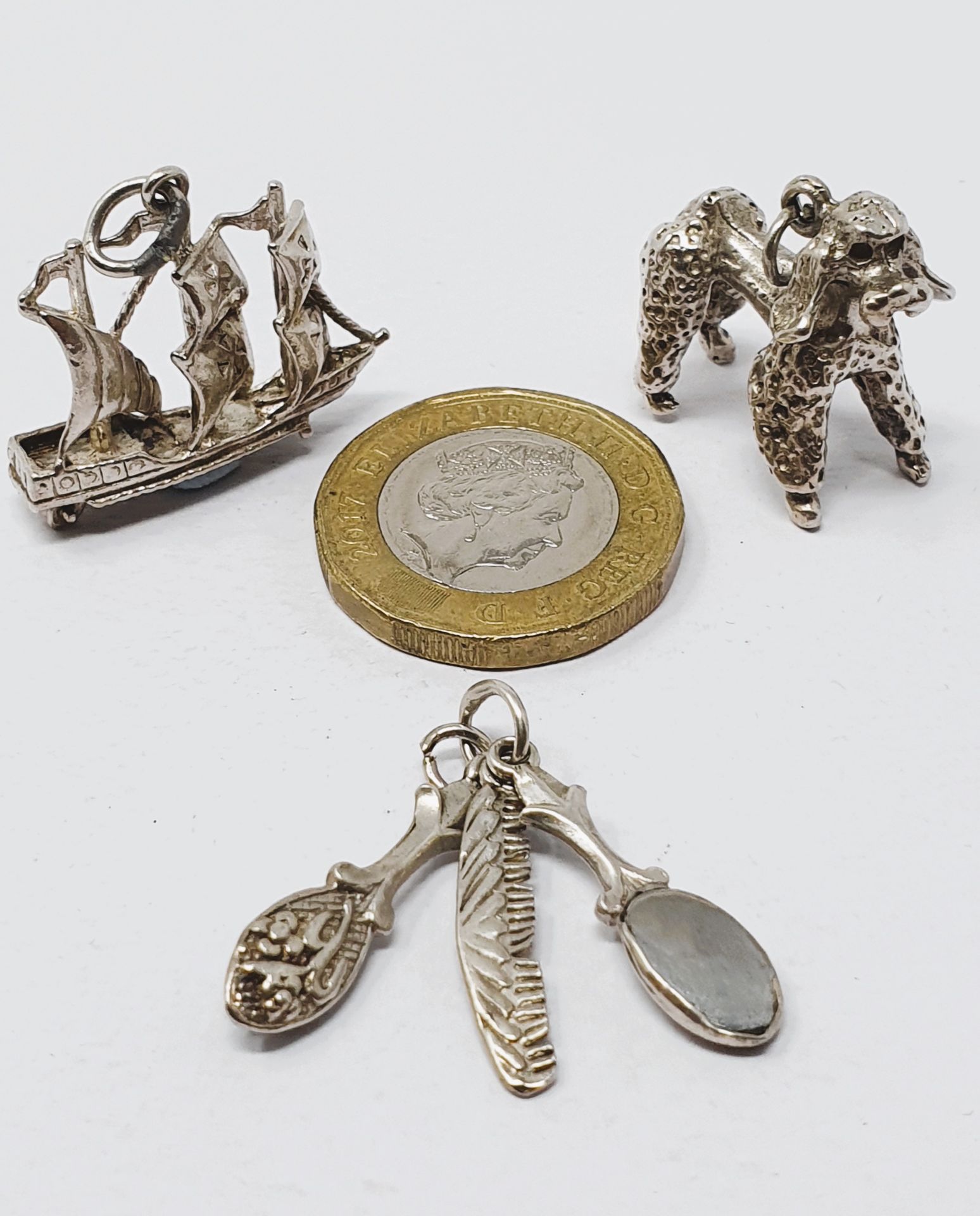 Sterling silver selection of thirteen vintage charms, including driving licence, comb and brush set, - Image 3 of 3