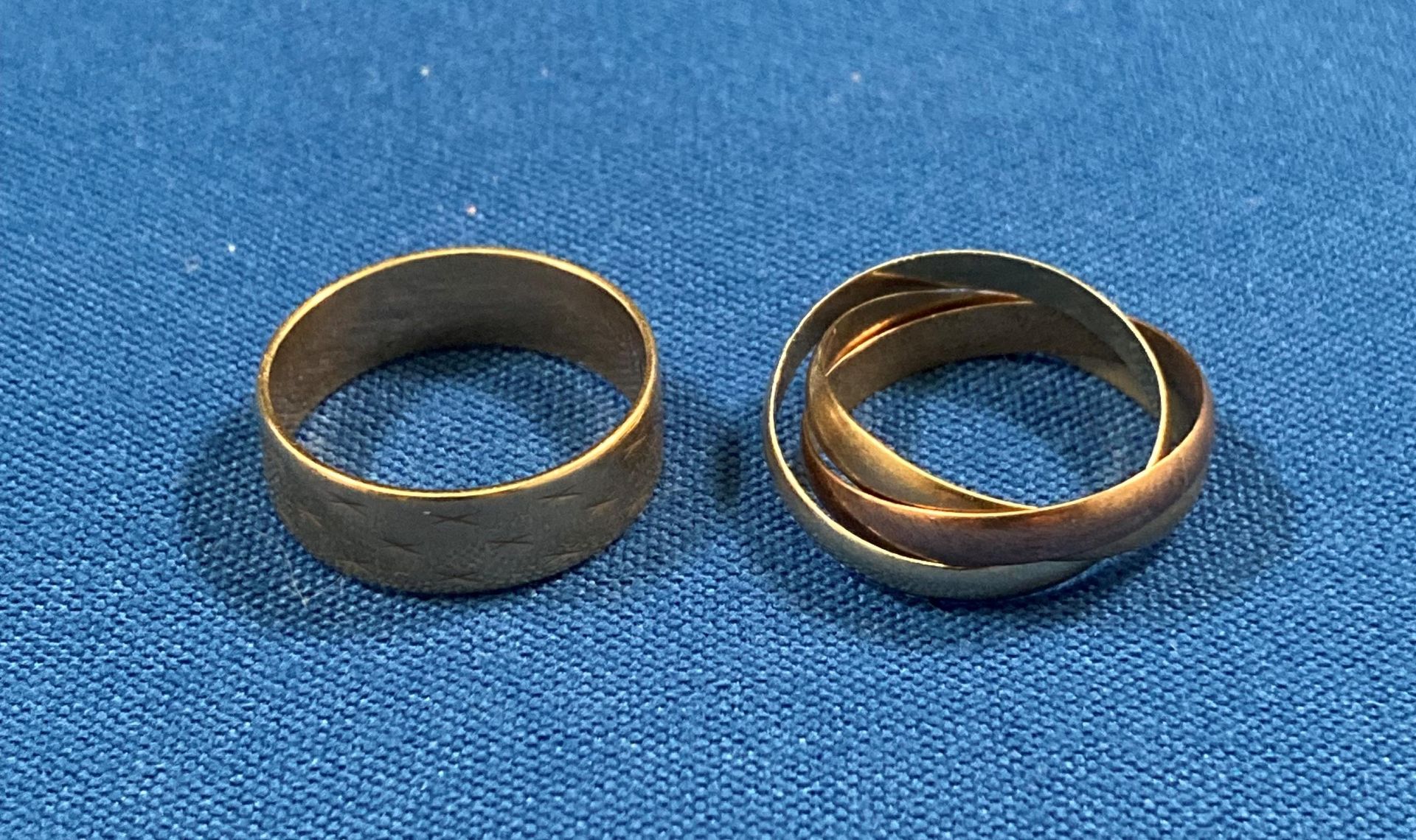 9ct gold (375) wedding band with etched 'X' (faded - size P+) and a 9ct gold (375) triple wedding