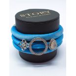 STORY' by Kranz & Ziegler blue silk wrap bracelet with three sterling silver charms, unworn / boxed,