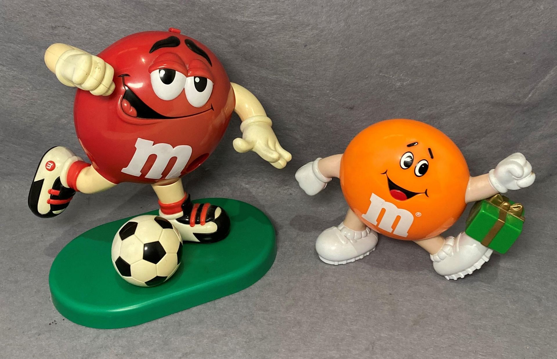 Two M&M plastic sweet containers (empty) (saleroom location: S3 T1)