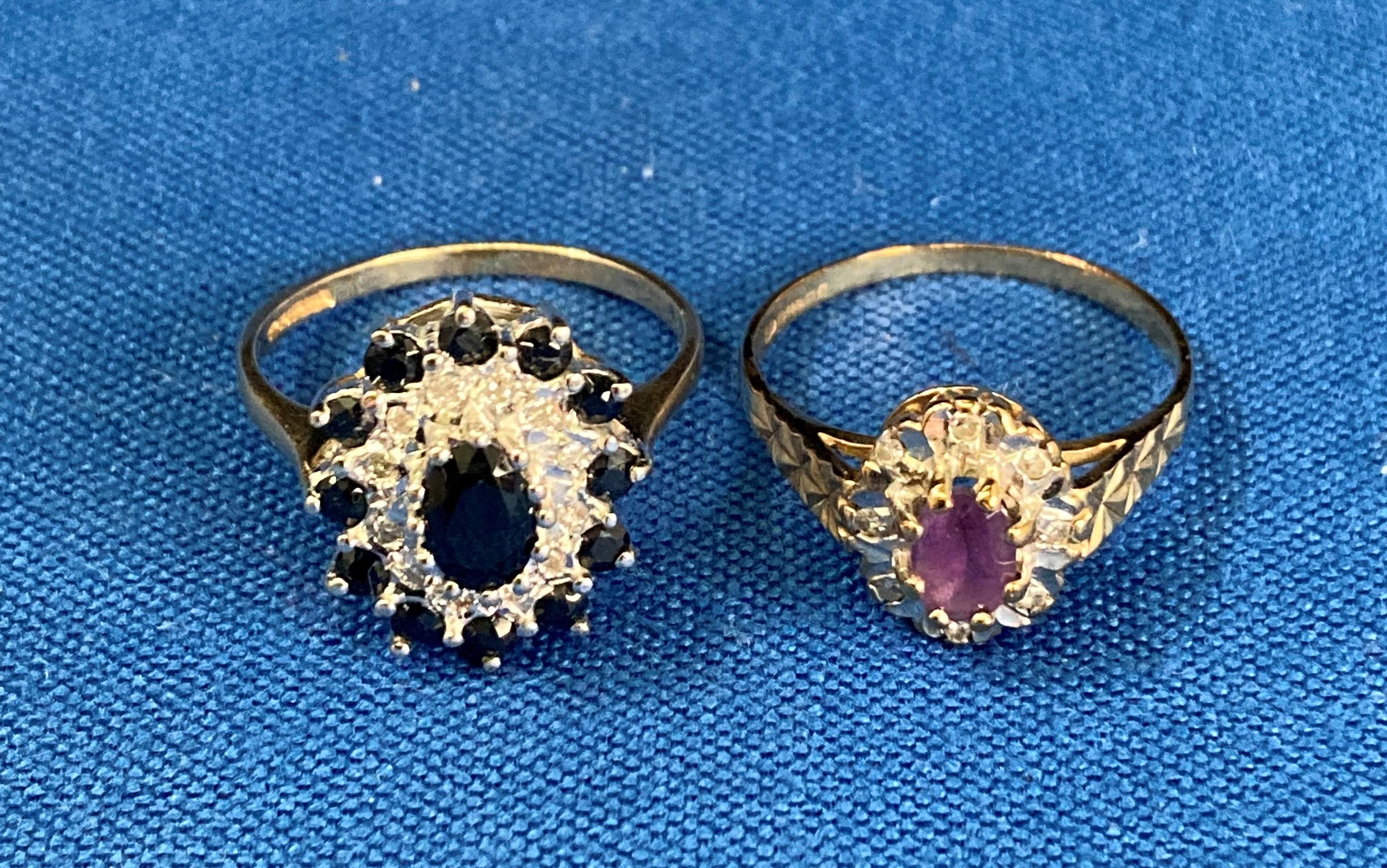 9ct gold (375) sapphire and diamond oval ring with central oval sapphire surrounded by