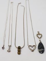 Sterling silver, four pendants with chains, two pendants without chains; sterling silver,