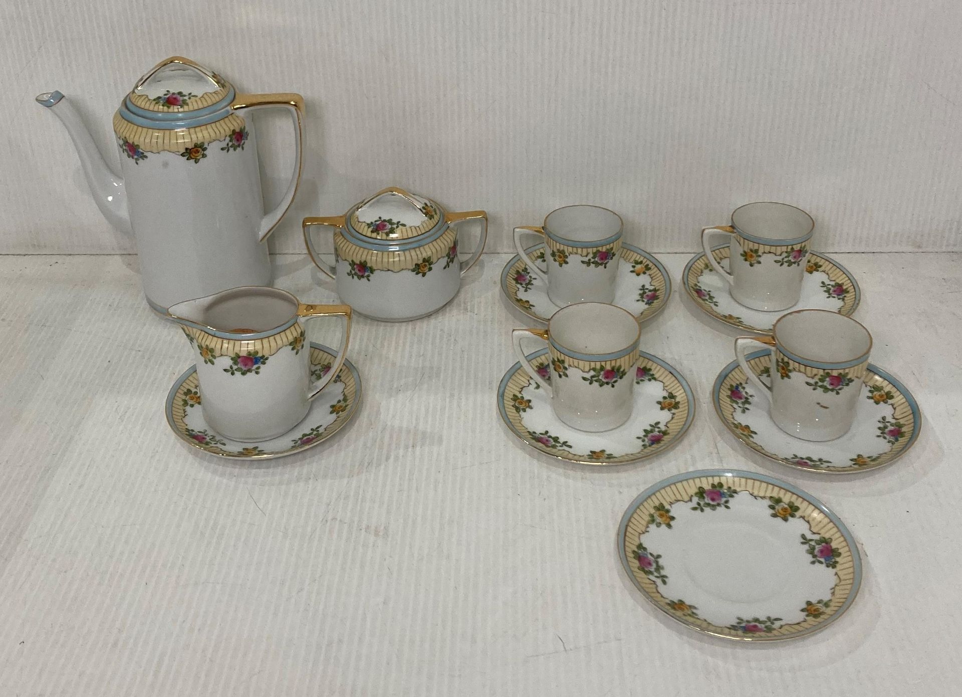 A vintage thirteen piece Noritake tea service including coffee pot, sugar bowl, cream jug,