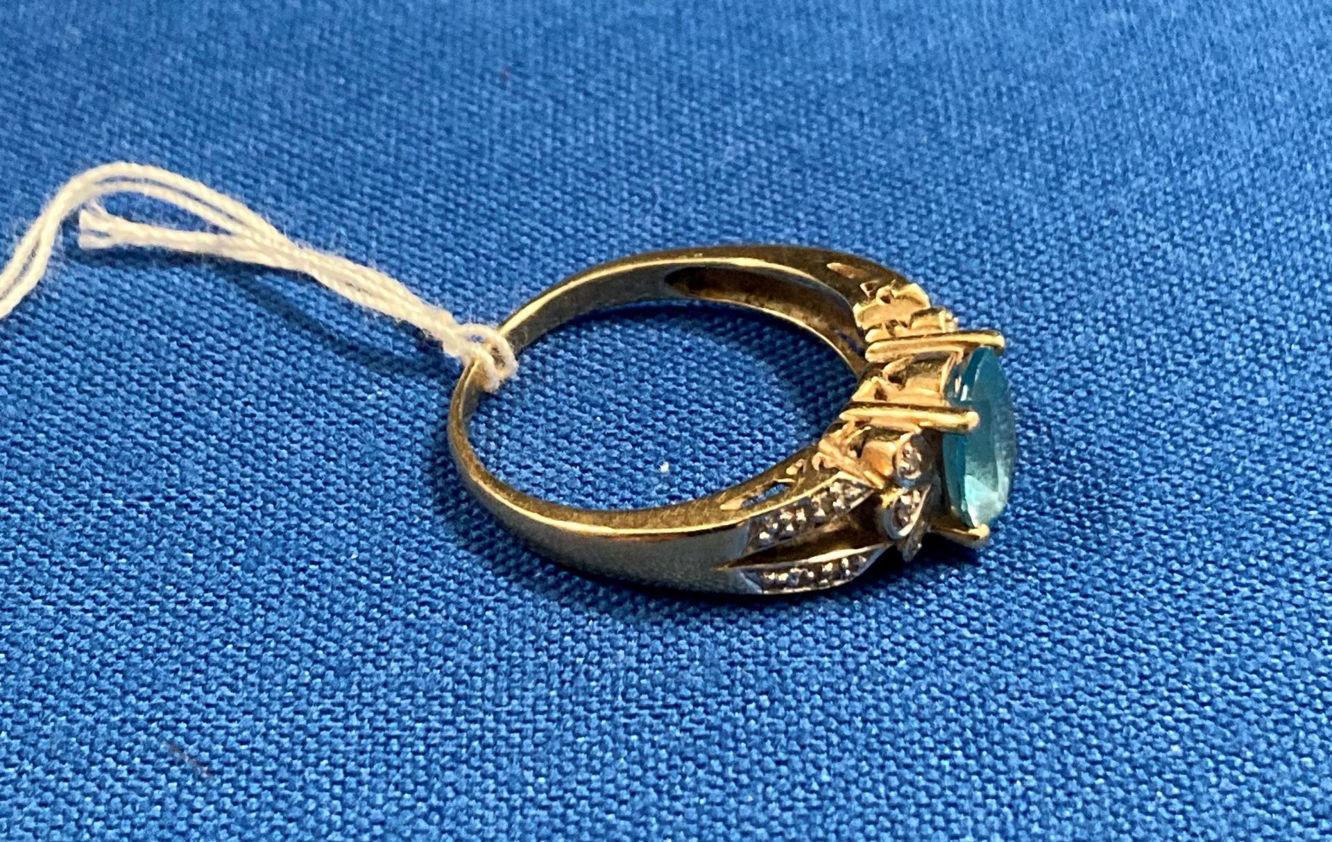 9ct gold (375) with small diamonds and central oval light-blue stone (possibly aquamarine) size Q. - Image 2 of 2