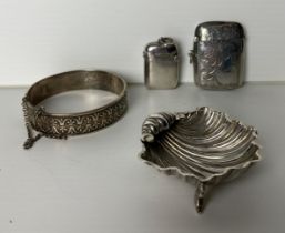 A vintage silver (1901, Birmingham) clam shell standing on fish legs by R.