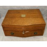 Mahogany serpentine front inlaid canteen of cutlery case with brass shield plaque,