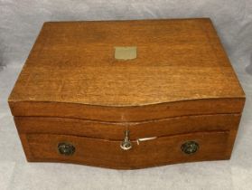 Mahogany serpentine front inlaid canteen of cutlery case with brass shield plaque,