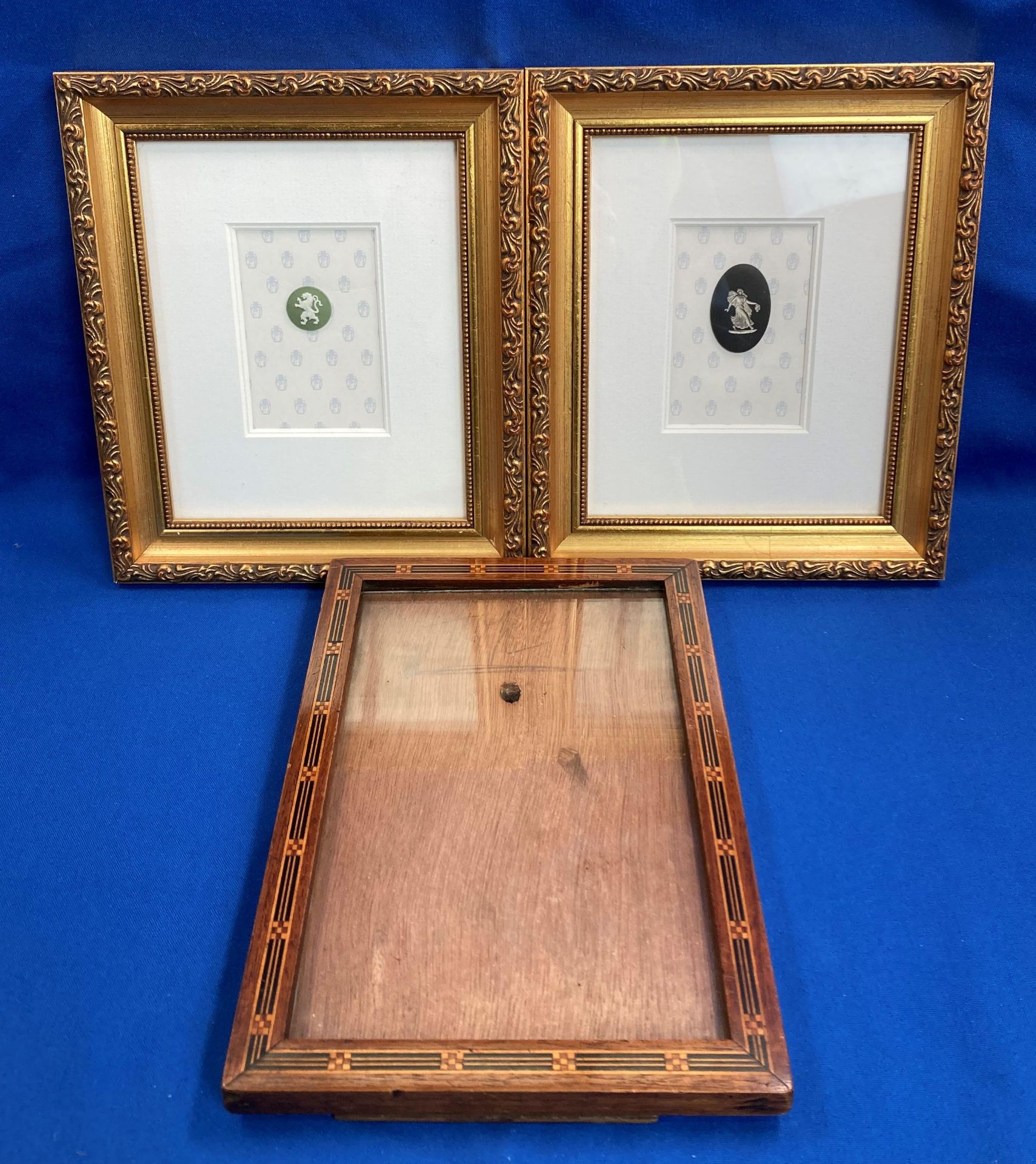 Two framed Wedgwood cameos (1992) each frame 21.5cm x 18.