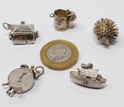 Sterling silver selection of fifteen charms, including clock, temple, boot, dustbin, IOM TT shield,