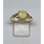 9ct gold faceted opal and CZ cross-over style solitaire ring, finger size P, gross weight 2.