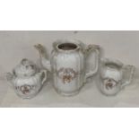 A late 19th Century Hermann Ohme three-piece tea service including sugar bowl (with lid), milk jug,