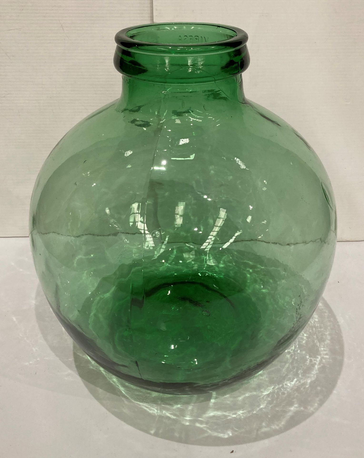 A green glass terrarium,