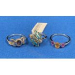 Three 9ct white gold (375) rings including a cluster ring with light-blue stones (size N+),