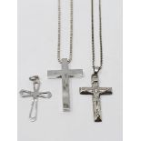 A sterling silver cross with chain, a sterling silver crucifix with chain,