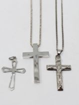 A sterling silver cross with chain, a sterling silver crucifix with chain,