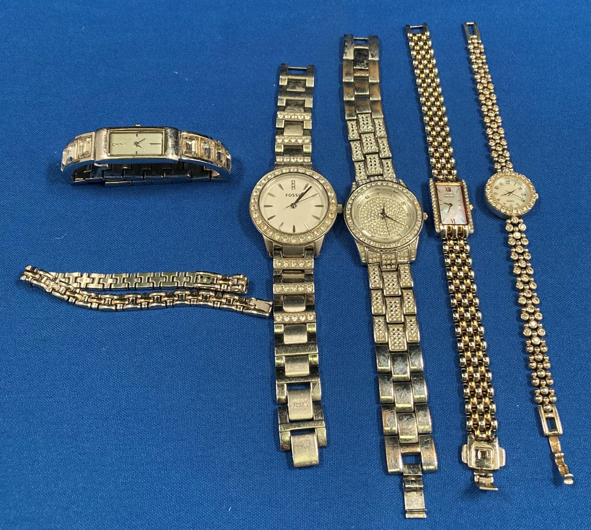 Five watches including a sterling silver (.