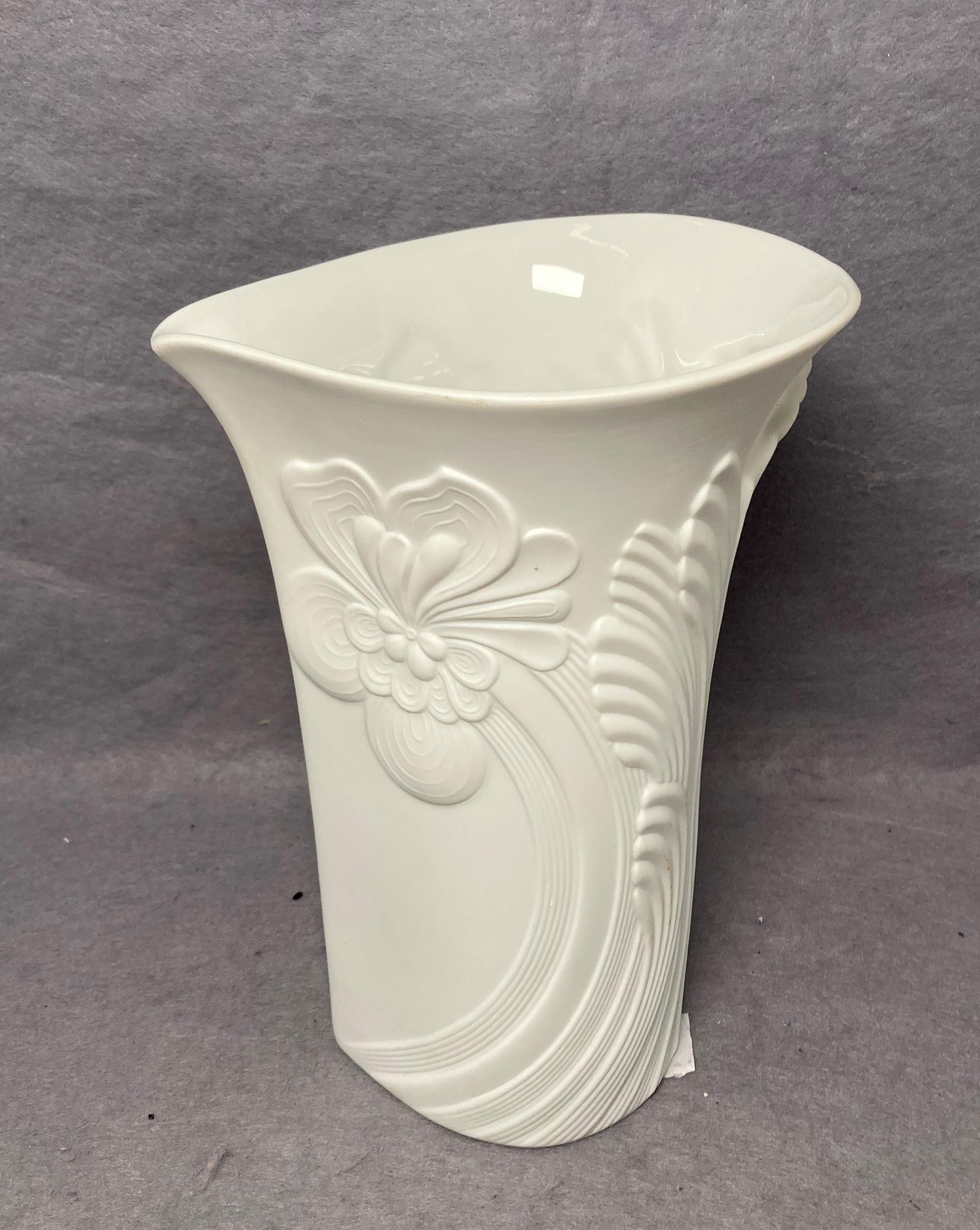 A Kaiser matte white vase decorated in flower designs no: 0333 with artist signature to base,