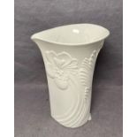 A Kaiser matte white vase decorated in flower designs no: 0333 with artist signature to base,