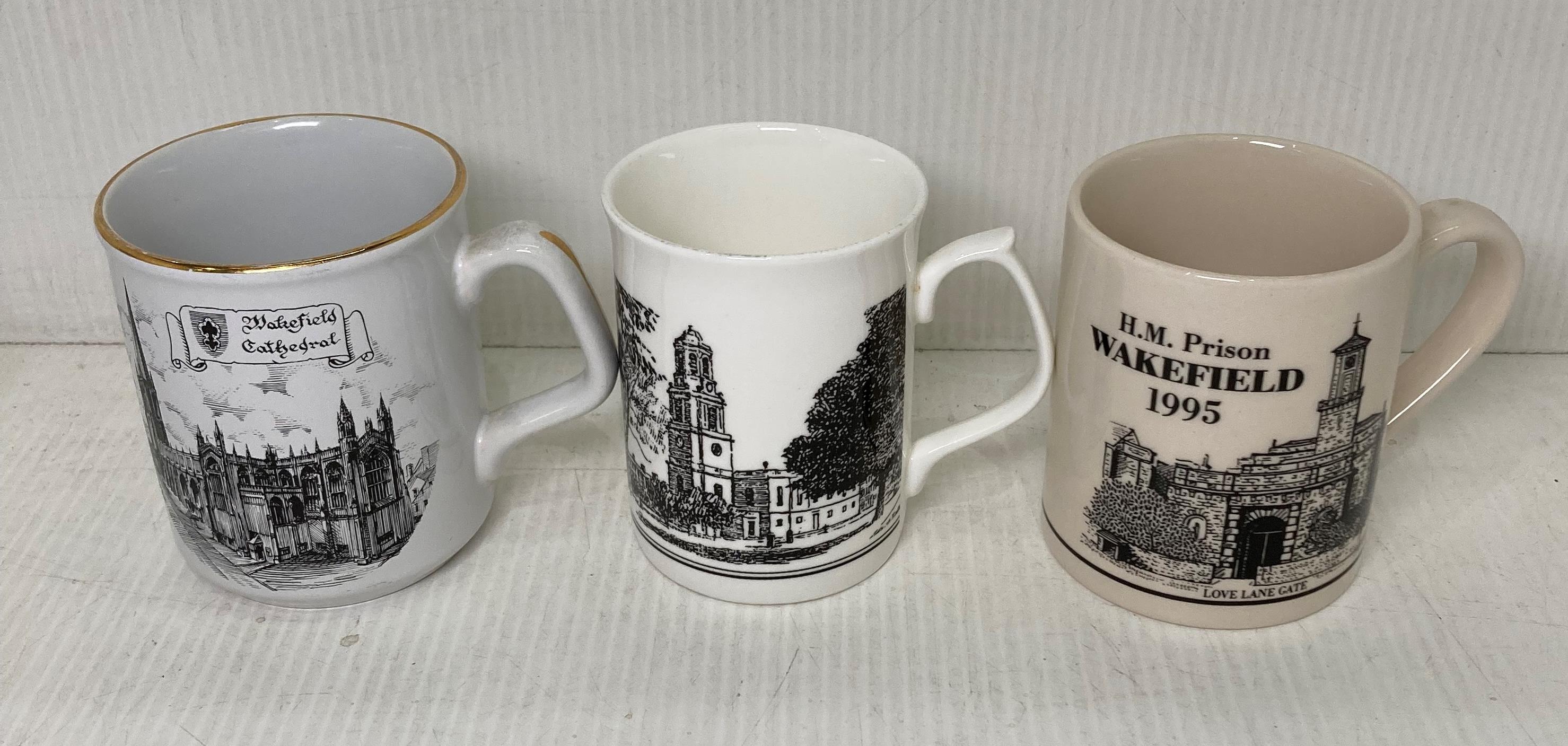 Three Wakefield related cups including H M Prison 1995, Cathedral,