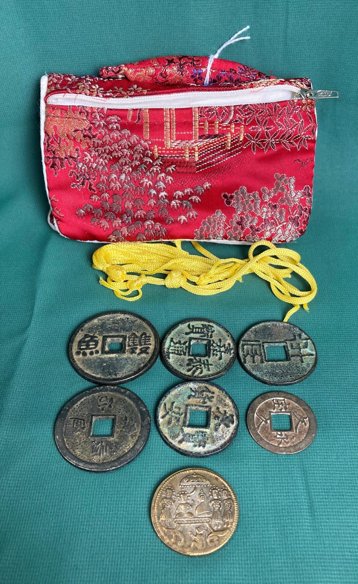 Five assorted antique bronze Oriental coins,