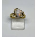 Opal solitaire ring stamped 9CT, finger size M, gross weight 1.