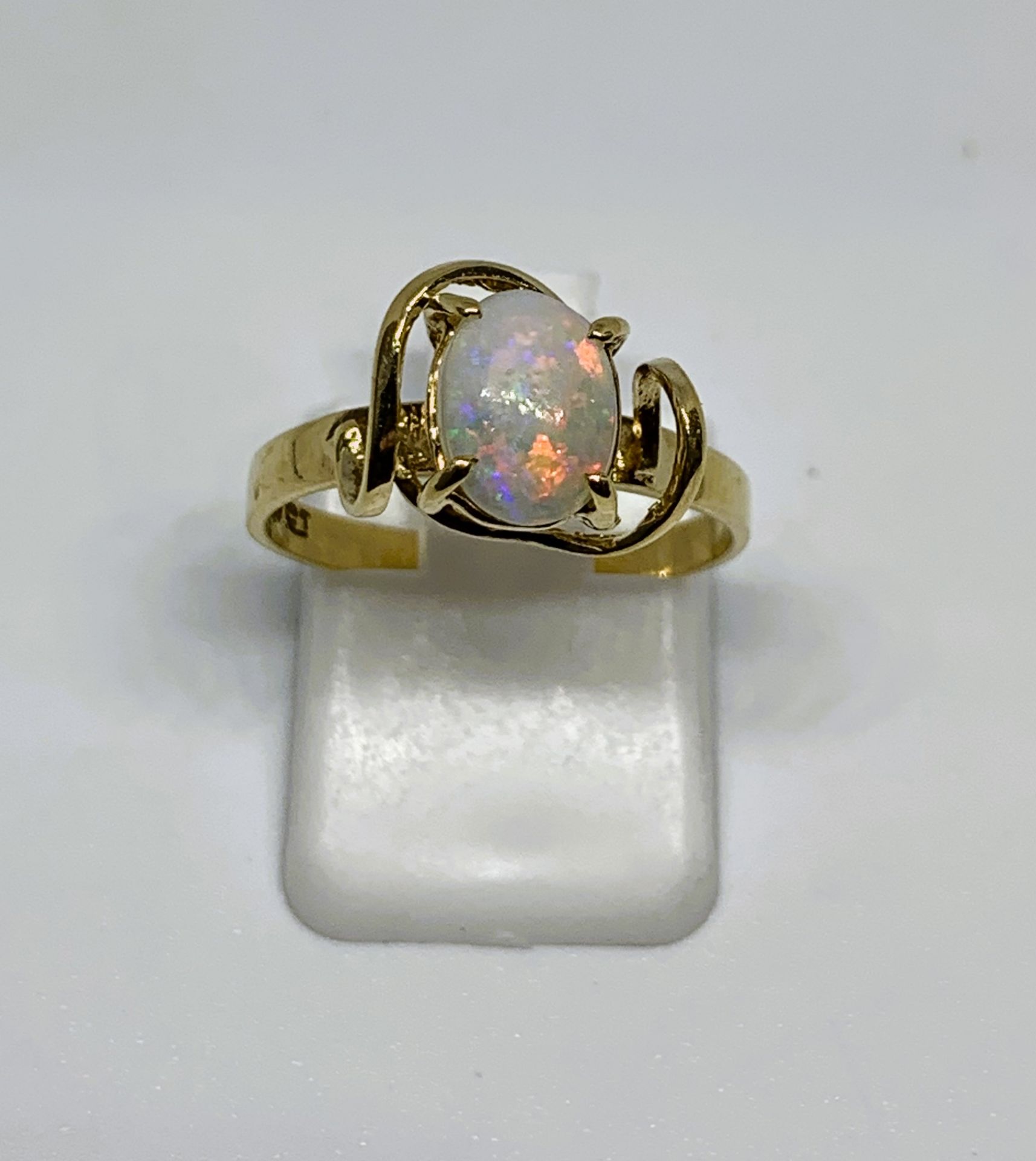 Opal solitaire ring stamped 9CT, finger size M, gross weight 1.