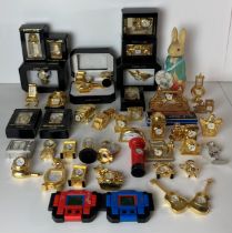 Forty assorted miniature gold tone clocks by Parklane, Empress, etc - including Kingfisher, Eagle,